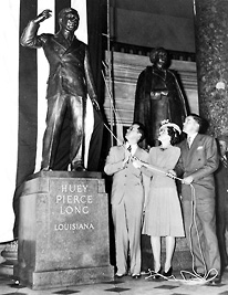 Huey Long's children, Russell, Rose and Palmer, unveil his statue in Statuary Hall of the U.S. Capitol.